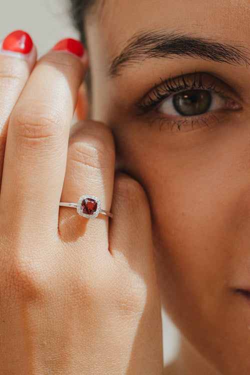 White gold, garnet and diamond ring